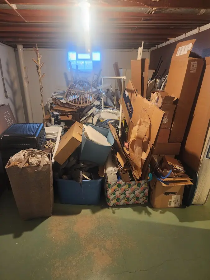 Roll-off dumpster container at job site for Yard Waste Dumpster Rental in Warren