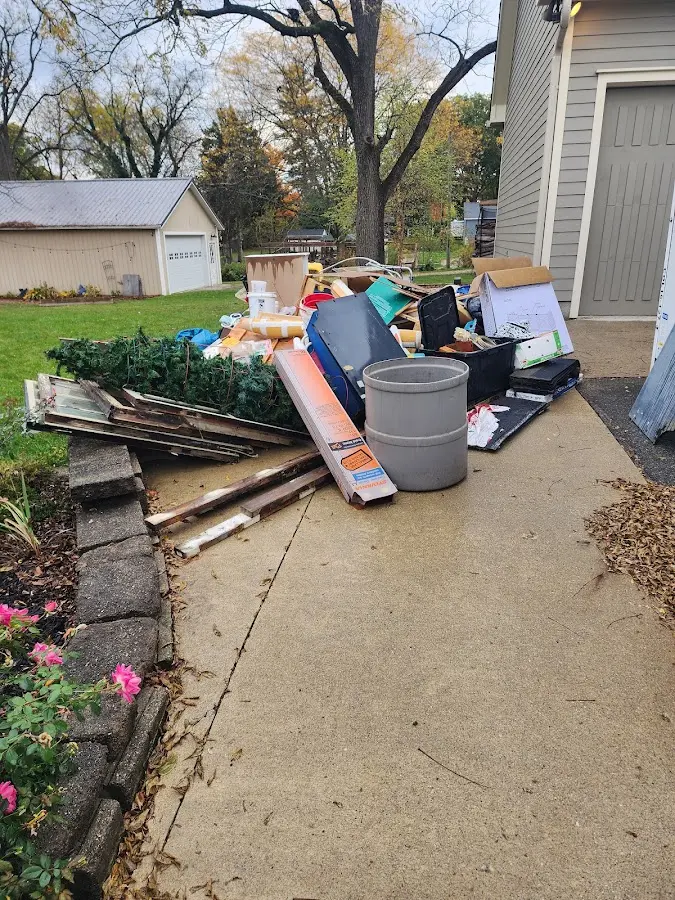 Dumpster being loaded with debris for 30 Yard Dumpster Rental in Warren